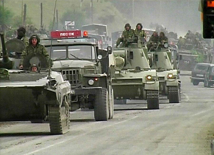 Russian+military+vehicles+move+toward+the+breakaway+South+Ossetia+republics+capital%2C+Tskhinvali%2C+on+Friday.+Russias+Defense+Ministry+says+it+has+sent+reinforcements+to+its+peacekeepers+deployed+to+South+Ossetia+to+help+end+bloodshed.+Georgian+officials+confirmed+that+the+Russian+convoy+had+crossed+the+border+and+was+advancing+toward+Tskhinvali.+Georgia+launched+a+massive+attack+Friday+to+regain+control+over+South+Ossetia%2C+using+heavy+artillery%2C+aircraft+and+armor.+South+Ossetian+officials+said+at+least+15+people+were+killed+Friday+and+an+unspecified+number+were+wounded.+%28AP+Photo%2FAPTN%29