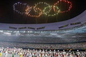 Fireworks in the shape of the Olympic rings are shown over National Stadium during the closing ceremony of the Beijing 2008 Olympics in Beijing, Sunday, Aug. 24, 2008. (AP Photo/Darron Cummings)