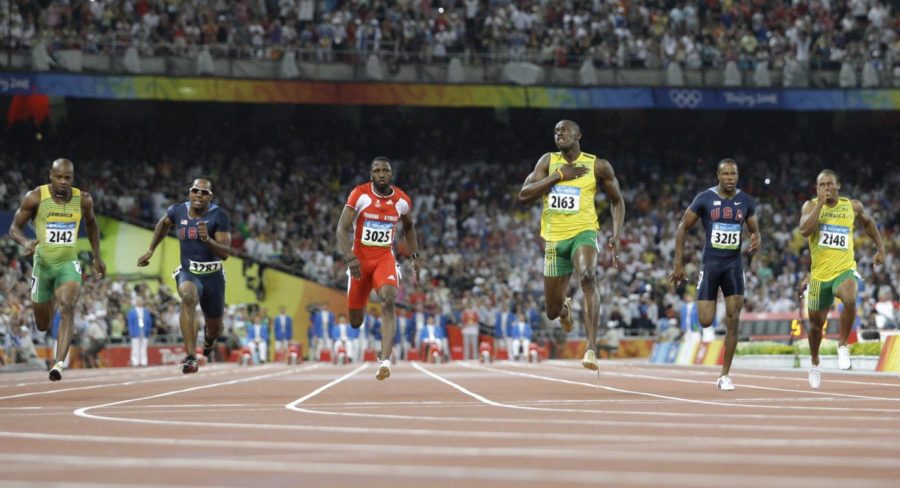 Usain Bolt of Jamaica, third right, reacts as he wins the men's 100-meter final with a world record in athletics competitions in the National Stadium at the Beijing 2008 Olympics in Beijing, Saturday, Aug. 16, 2008. Other runners are, from left, Asafa Powell of Jamaica, Walter Dix of United States, Richard Thompson of Trinidad, Bolt, Darvis Patton of United States and Michael Frater of Jamaica. (AP Photo/Anja Niedringhaus)