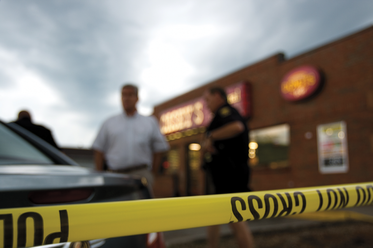 Police taped off the scene of the Caseys General Store on Lincoln Way and began searching for evidence after finding the body of clerk Lacrissa Davis, of Ames, dead on July 27. Photo: Shing Kai Chan/Iowa State Daily