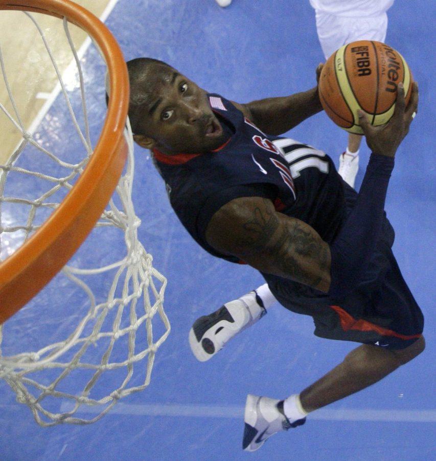 USA's Kobe Bryant goes up for a dunk against Spain during a men's preliminary basketball game at the Beijing 2008 Olympics in Beijing, Saturday, Aug. 16, 2008. (AP Photo/Eric Gay, Pool)