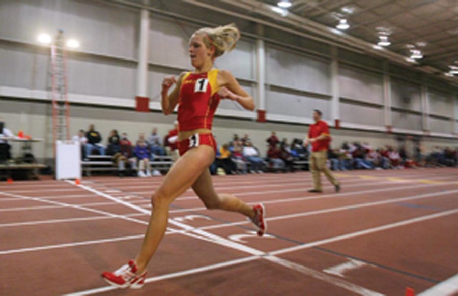 Iowa States Lisa Koll crosses the finish line breaking the school record and her own personal record for the 5,000-meter run earning first place with a time of 15:52.37 on Feb. 15 at the Lied Recreation Center.