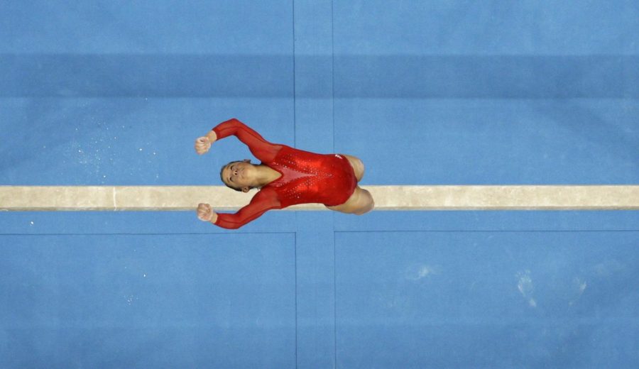 U.S. gymnast Shawn Johnson performs on the balance beam during the womens' gymnastics individual all-around finals at the Beijing 2008 Olympics in Beijing, Friday, Aug. 15, 2008. (AP Photo/Rob Carr)