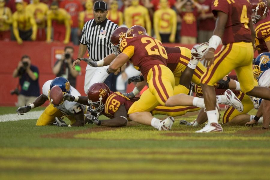 Iowa States Rashawn Parker reaches for a loose ball on Thursday at Jack Trice Stadium. The Cyclones lead the Jackrabbits 20-0 at half time of the Season Opener. Photo: Josh Harrell/Iowa State Daily