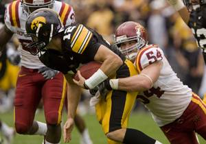 Iowa State’s Jesse Smith sacks Iowa’s Ricky Stanzi during the game Saturday at Kinnick Stadium in Iowa City. The Cyclone defense held the Hawkeye offense to three points until two minutes into the fourth quarter. Photo: Josh Harrell/Iowa State Daily