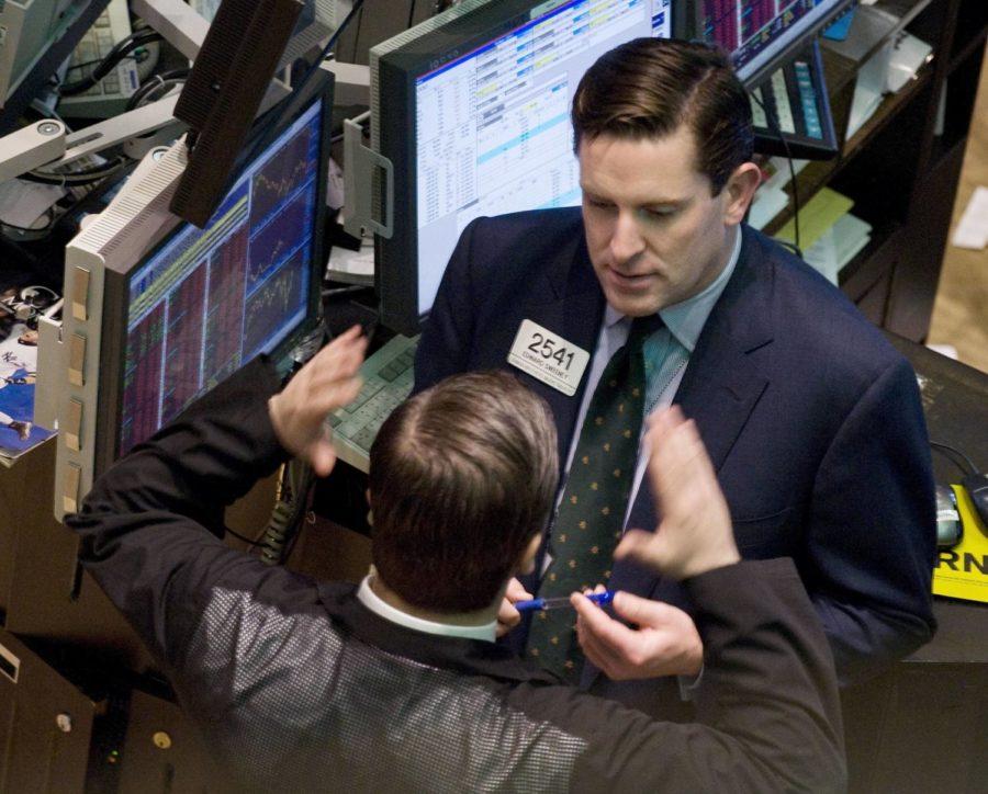 Specialist Edward Sweeney, right, talks with a colleague on the floor of the New York Stock Exchange, Wednesday, Sept. 17, 2008. Wall Street stumbled again Wednesday, with anxieties about the financial system still running high after the government bailed out insurer American International Group Inc. (AP Photo/Richard Drew)