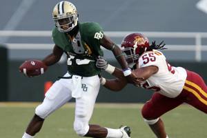 Baylor quarterback Robert Griffin is chased by Iowa State defender Christopher Lyle in an NCAA college football game, Saturday, Oct. 11, 2008 in Waco, Texas. Photo: Duane A. Laverty/Associated Press