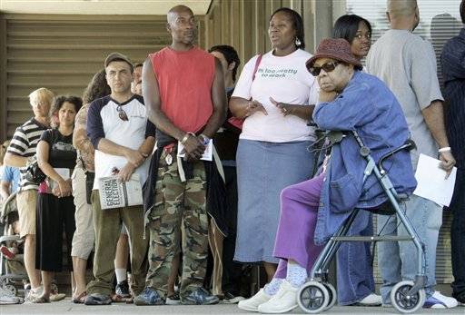 Hundreds of votes stand in long lines to cast their general election ballots a week early at the Los Angeles County Registrar-Recorder's office in Norwalk, Calif., Tuesday, Oct. 28, 2008. California isn't considered a swing state and polls show Democratic candidate Barack Obama holds a hefty lead over Republican rival John McCain. Even so, election officials say voter registration soared in California before last week's deadline for the Nov. 4 election. In battleground states such as Ohio and Florida, voters have lined up for hours to cast their ballots early. (AP Photo/Reed Saxon)