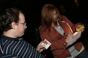 Tim Reineke, senior in political science, gives locations of possible repair to Stephanie Reinhold, junior in child, adult, and family services, Monday night October 22, 2007 in Campustown. A mix of students and Ames community members got into groups of four or five and each took a section of Campustown to look for places of repair such as broken pavement, dimmed or darkened street lights, and potholes. Photo: Eloisa Perez-Lozano/Iowa State Daily