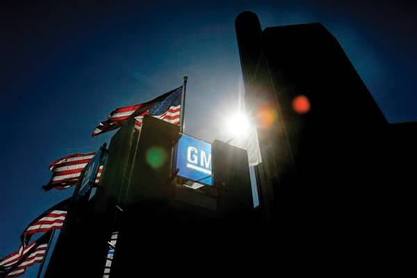 **FILE** In this July 15, 2008 file photo, the General Motors world headquarters in Detroit is seen on. With its cash stockpile perilously low and the prospect of government help fading, General Motors Corp. probably is talking with creditors to buy time until Barack Obama arrives in Washington. (AP Photo/Carlos Osorio, File)