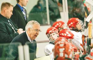 Coach Al Murdoch yells at players during Friday's game against Arizona State in the Ames/ISU Ice Arena. On Saturday Murdoch set the record for career wins as a collegiate hockey coach at any level. Photo: Shing Kai Chan/Iowa State Daily