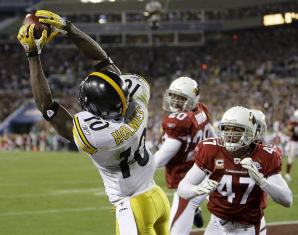 Pittsburgh Steelers wide receiver Santonio Holmes(10) catches a touchdown pass as Arizona Cardinals safety Aaron Francisco(47) and his teammate Ralph Brown watch during the fourth quarter of the NFL Super Bowl XLIII football game, Sunday, Feb. 1, 2009, in Tampa, Fla. (AP Photo/Chris O'Meara)