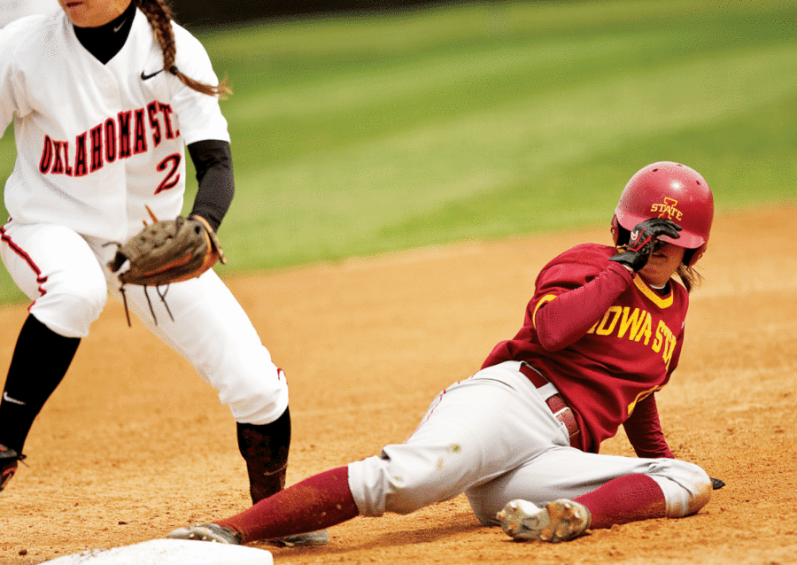 Iowa State's Kelsey Kidwell, 11, sides into third base safe during the game against Oklahoma State on Sunday, April 19, 2009, at the Southwest Athletic Complex. The Cyclones rallied through a few questionable calls to beat the Cowboys 4-1. Photo: Josh Harrell/Iowa State Daily