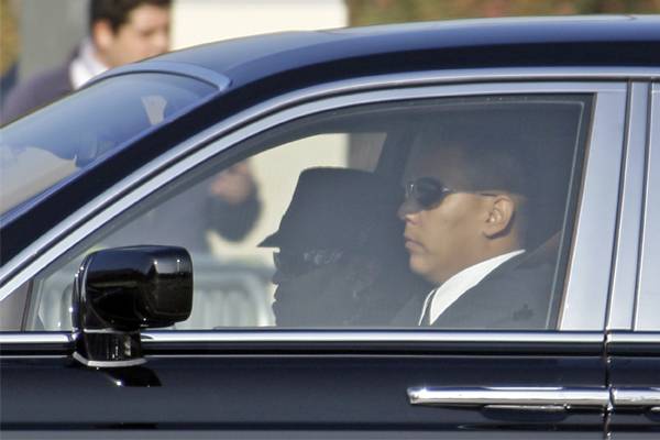 A silhouetted figure of Joe Jackson is seen in the passenger seat of the lead car in a motorcade of vehicles arriving at Forest Lawn Hollywood Hills Memorial Park in Los Angeles Tuesday, July 7, 2009, prior to the memorial service for Michael Jackson. (AP Photo/Reed Saxon)