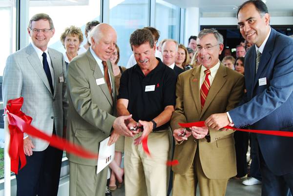 Steve King, Iowa State University Alumnus and patron to the new King Pavilion at the College of Design, cuts the ribbon with President Geoffory at the King Pavilion dedication ceremony Monday at 5 p.m. in the College of Design. The pavilion houses new design studio class spaces for students, review space and faculty offices. Photo: Christine Naulty/Iowa State Daily