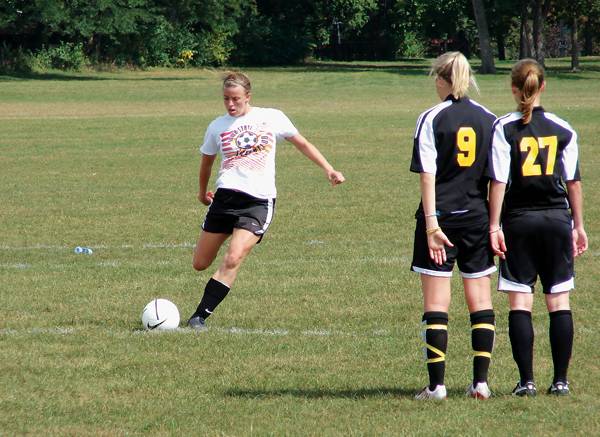 Iowa State Women's Club team member Kim Allen takes a direct kick during the team's home tournament on Sunday. Allen is a senior forward and co-president of the club. Photo: Dan Tracy/Iowa State Daily (Sports Reporter)