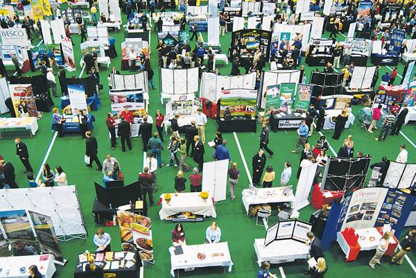 Over 150 company tables fill the Lied Recreation Athletic CenterTuesday for the Fall Ag Career Day. As the largest event of Ag Week,Ag Career Day is a great chance for employers and job seekers to makeconnections. Photo: Christine Naulty/Iowa State Daily