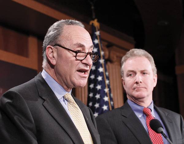 Sen. Charles Schumer, left, accompanied by Rep. Chris Van Hollen, talks to reporters Jan. 21 on Capitol Hill in Washington. The Supreme Court’s decision on campaign finance has jumbled a seemingly simple rule of American politics. The ruling overturned a law that limited the size of campaign contributions by corporations and unions. Photo: Victoria Burke/The Associated Press