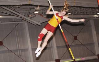 Sophomore Caitlin Weber competes in the pole vault competition at the ISU Open during the indoor track and field season. Photo: Kasey Sutherland/Iowa State Daily