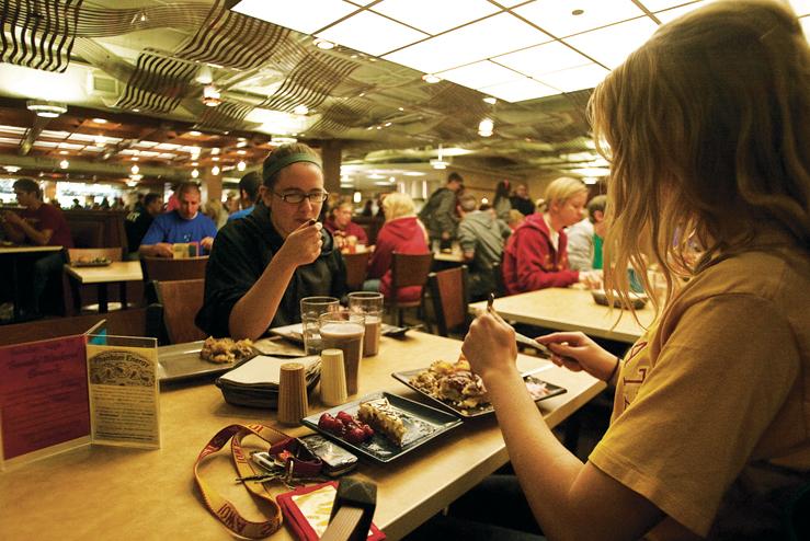 Students dine without trays at Seasons Dining Center beneath Maple-Willow-Larch.  The system also saves energy by cutting out washing and sanitizing trays.