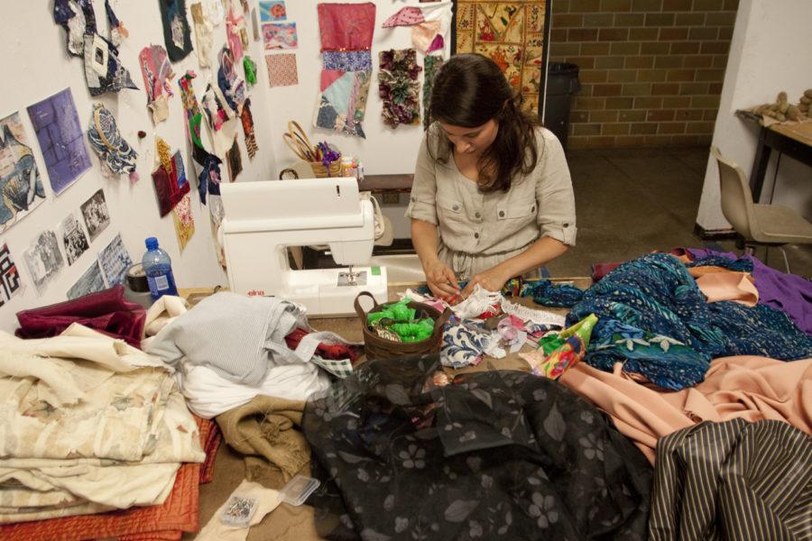 Neena Hayreh, undeclared graduate, works on a quilt for the Burning Man Festival. The project is one of the requirements of Samantha Krukowskis summer design class and will be put on display at the Burning Man Festival in August. 