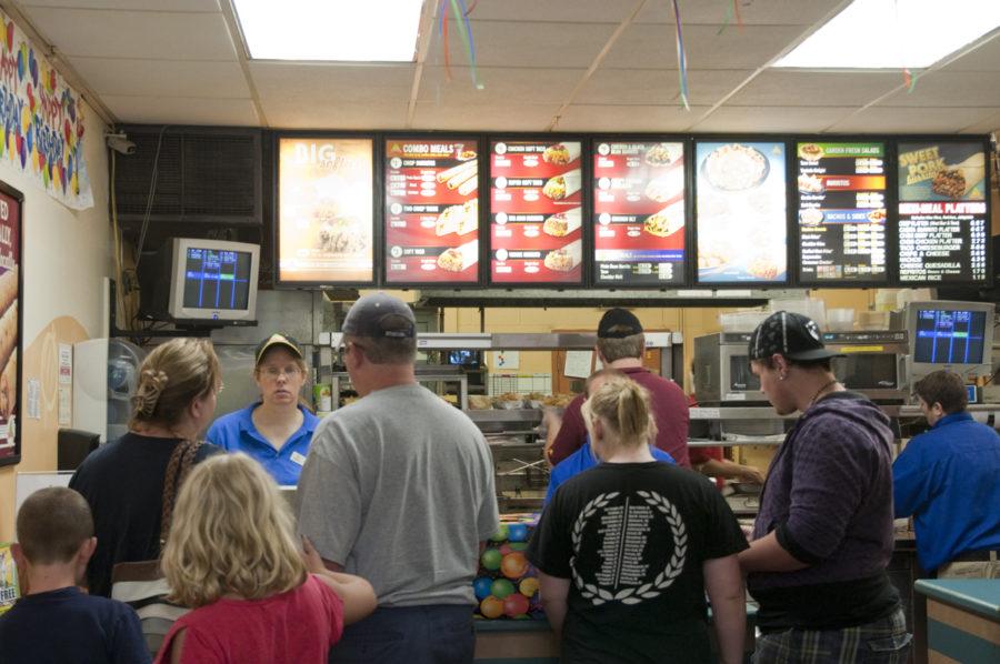 Customers line up for lunch orders on Monday at Taco Time. Taco Time is celebrating their 40th year of business in Ames. The location has sold over 1 million of its signature Crisp Meat Burritos since it first opened in 1969. 