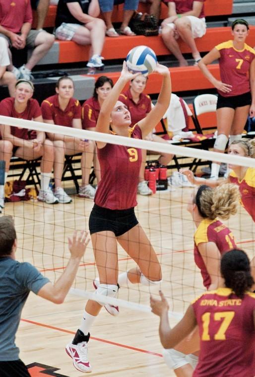 Setter Alison Landwehr sets the ball for a teammate during the Cardinal and Gold Scrimmage on Saturday, Aug. 21, at Ames High School. 