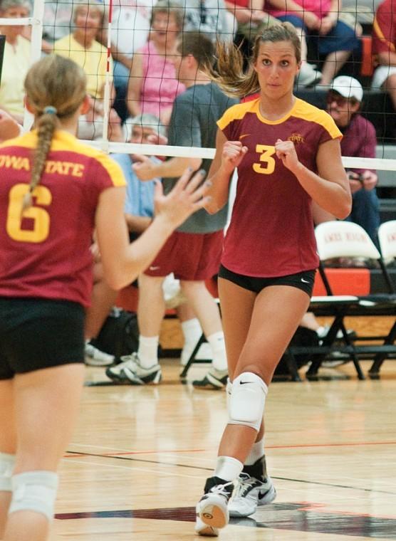 Outside hitter Rachel Hockaday reacts after a kill on Saturday, Aug. 21, at Ames High during the Cardinal-Gold Scrimmage.