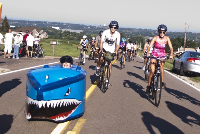A biker Sunday had fashioned his recumbent style bike into a shark design.  