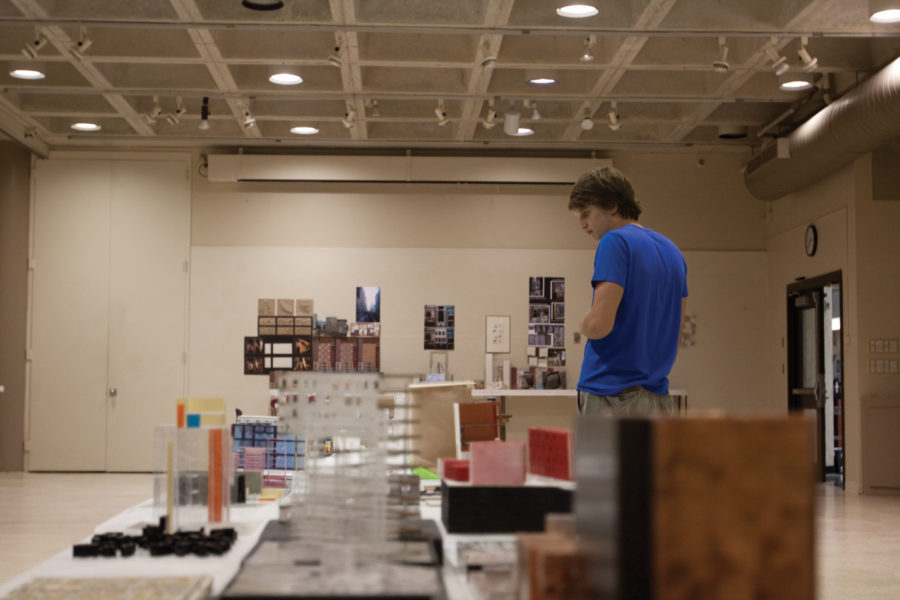 Jacob Marti, senior in integrated studio arts, looks at work of other students at the Powers of 10 Exhibition on Monday, Aug. 30 at the College of Design Building. The exhibition features work of students from the spring 2010 second-year architecture studio class. 