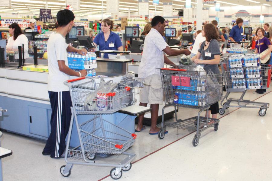 Customers at the west Ames Hy-Vee buy packages of water after the water plant temporarily shut down Wednesday, Aug. 11, 2010. The water plant temporarily shut down due to flooding. 