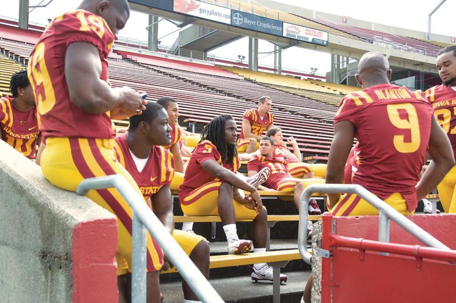 Cyclone football players wait for pictures on Media Day on Aug. 4 at Jack Trice Stadium.