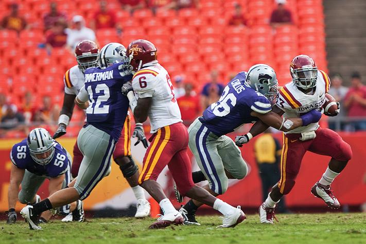 ISU running back Alexander Robinson tries to evade a tackle against Kansas State on Sept. 18 in Kansas City.