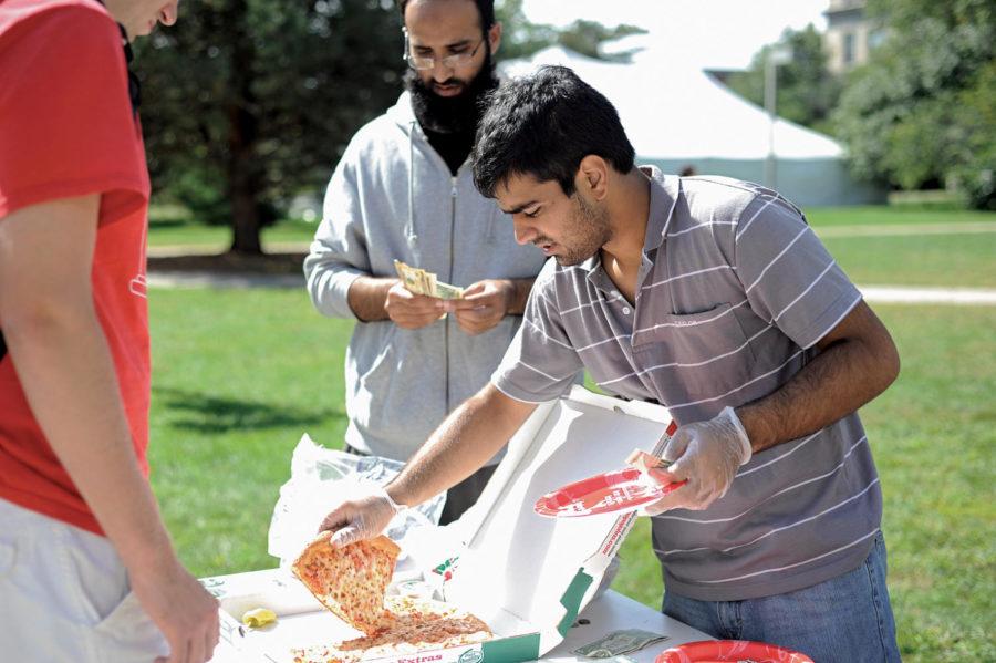 Sayyid Jibril, sophomore in bio-informatics, sells pizza Wednesday to raise money for Pakistani students affected by the flood. Nearly 20 to 25 percent of the countrys population, some 28 million people, are affected by flooding.