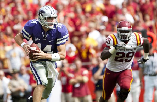 Kansas States quarterback Carson Coffman runs away from the ISU defense in the first half of the game between Iowa State and Kansas State in Kansas City, Mo.