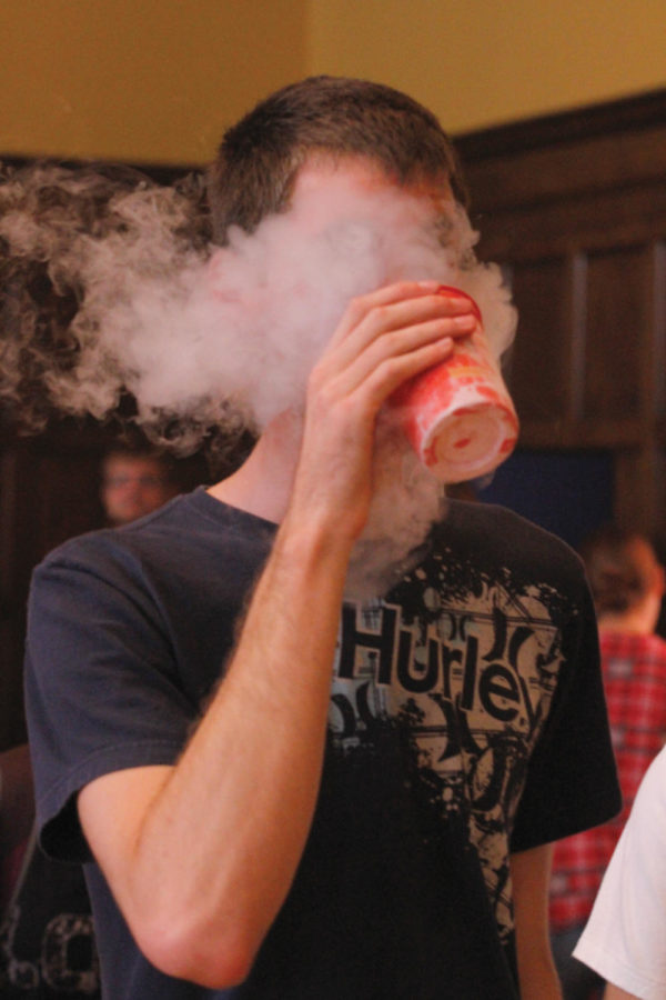 Michael Felderman, senior in physics, mock drinks liquid nitrogen during ClubFest on Sept. 8 in the Memorial Union. Felderman is a member of the Physics Club, which entertained onlookers by freezing marshmallows with liquid nitrogen.