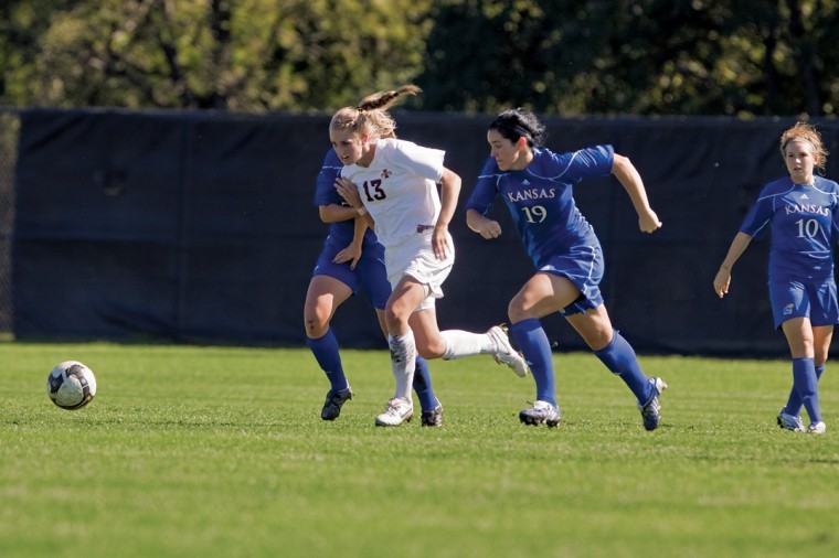Defender Jessica Stewart fights to get the ball during Sundays game against Kansas. Stewart had one of the goals that helped the Cyclones defeat the Jayhawks 2-0.