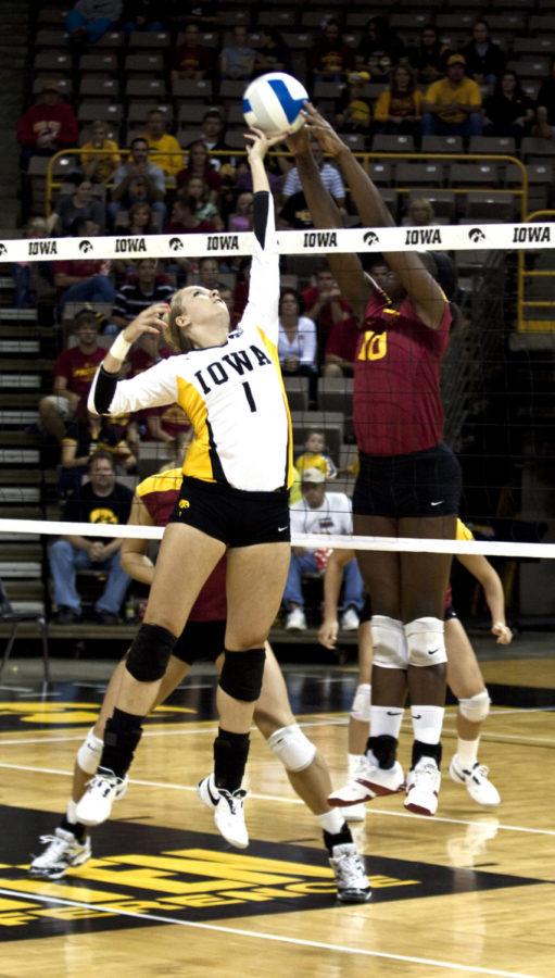Victoria Henson blocks a Hawkeye tip during the Hy-Vee Cy-Hawk series volleyball game at Carver Hawkeye Arena on Friday, Sept. 10. The Cyclones swept the Hawkeyes in three games.