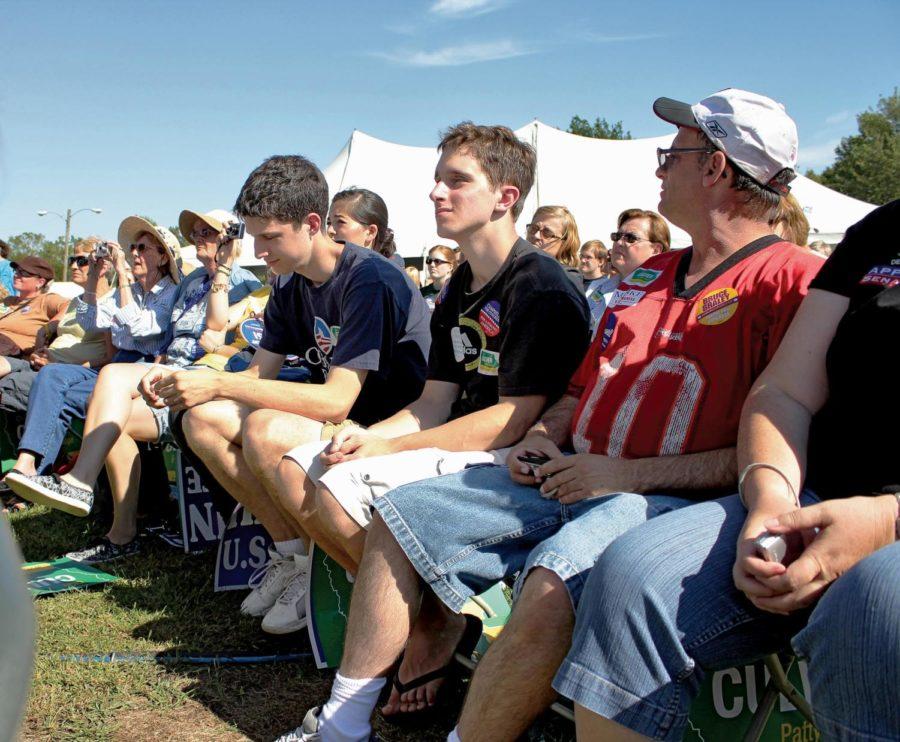 Two young people listen to politicians at the Harkin Steak Fry. In 1008, 66 percent of young voters polled for Barack Obama, but its less likely the same turnout will happen in a midterm election.