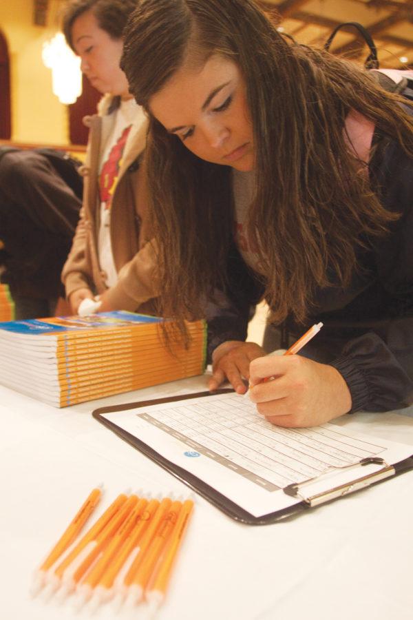 Branygon Kunzie, freshman in animal science, signs up for more information on studying abroad Thursday, Sept. 16, in the Great Hall of the Memorial Union during the Study Abroad Fair.