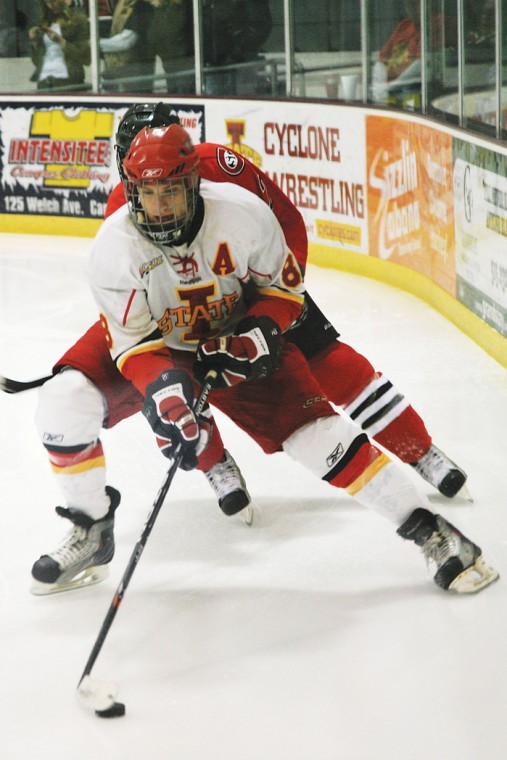 Iowa States Cort Bulloch maneuvers the puck against St. Cloud State on Saturday at the Ames/ISU Ice Arena. 