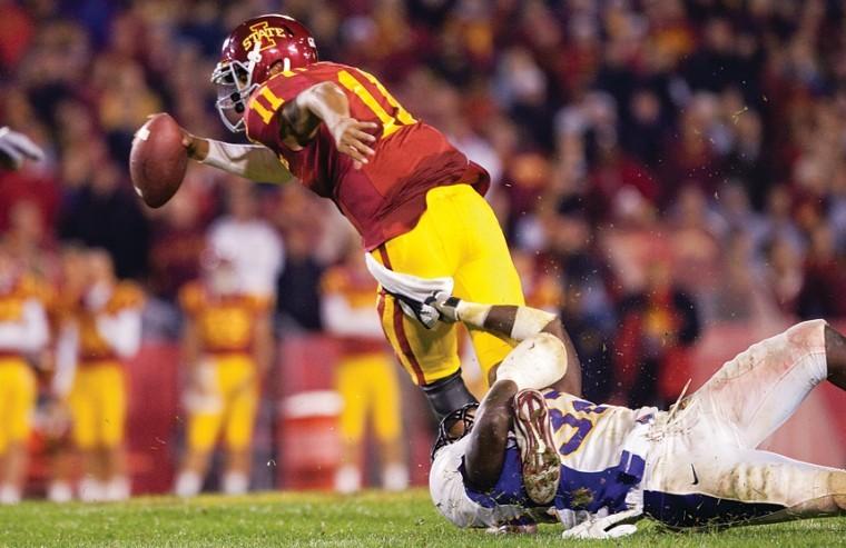 Iowa States Jerome Tiller attempts to evade a tackle by a Northern Iowa player during the Cyclones game against Northern Iowa on Saturday in Jack Trice Stadium.  The Cyclones won 27-0.