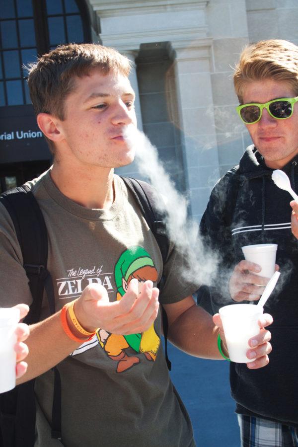 Ben Tallman, freshman in engineering, eats marshmallows frozen by liquid nitrogen at the Society of Chemistry Undergraduate Majors (SCUM) booth during ClubFest on Wednesday, Sept. 8, outside the Memorial Union. While visiting the SCUM booth, students could also try ice cream frozen with liquid nitrogen.