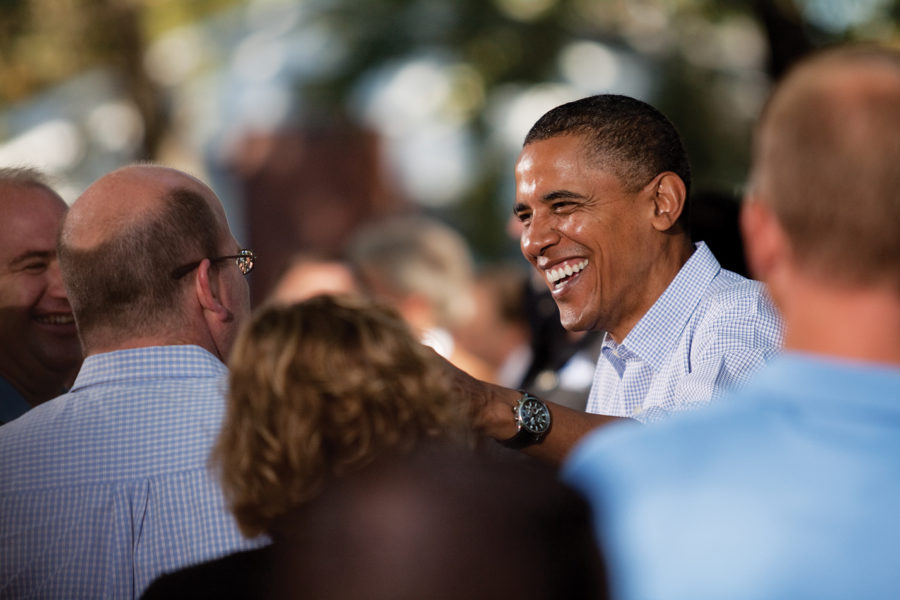 President Barack Obama greets people after a backyard chat Sept. 29 in Des Moines. Jeff and Sandy Hatfield-Clubb hosted guests in the upper-middle-class neighborhood of Beaverdale while the president discussed middle-class economic challenges. Photo: Jessica Opoien/Iowa State Daily