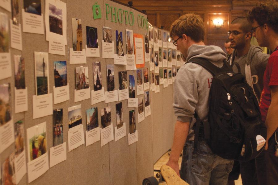 Students look at photos from the Study Abroad photo contest while visiting the Study Abroad Fair on Thursday, Sept. 16, in the Great Hall of the Memorial Union.