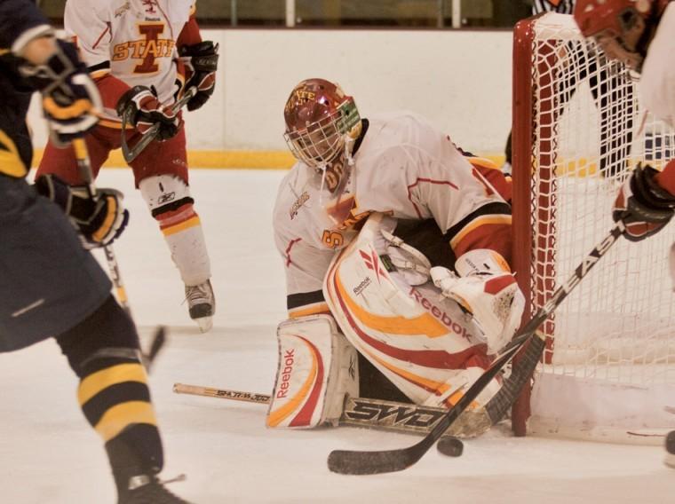 Goalie Erik Hudson prepares to stop the puck from entering the goal during Fridays game against Central Oklahoma at the Ames/ISU Ice Arena. The Cyclones defeated the Bronchos 8-3.