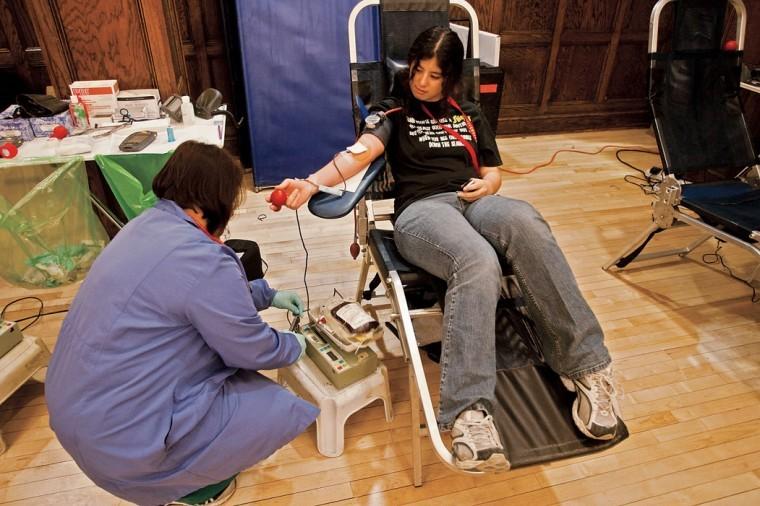 Dawn Moon, left, prepares Tonya Nelson during a blood drive on March 24, 2009, in the Great Hall of the Memorial Union.