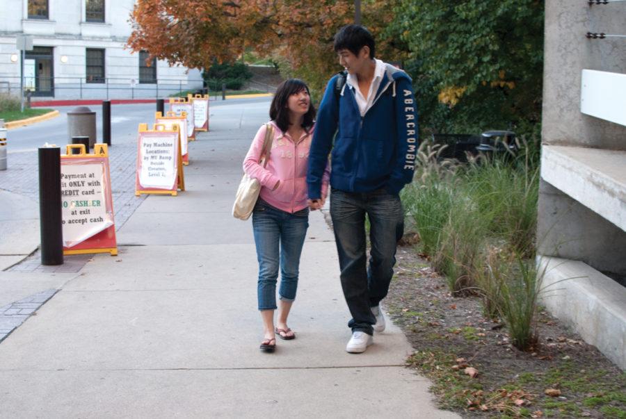 Wu Qing, junior in accounting and Dangxing Chen, freshman in statistics, walk around campus after class, Thursday, Oct. 7, near the Memorial Union. They met at Iowa State and started dating a year ago.  