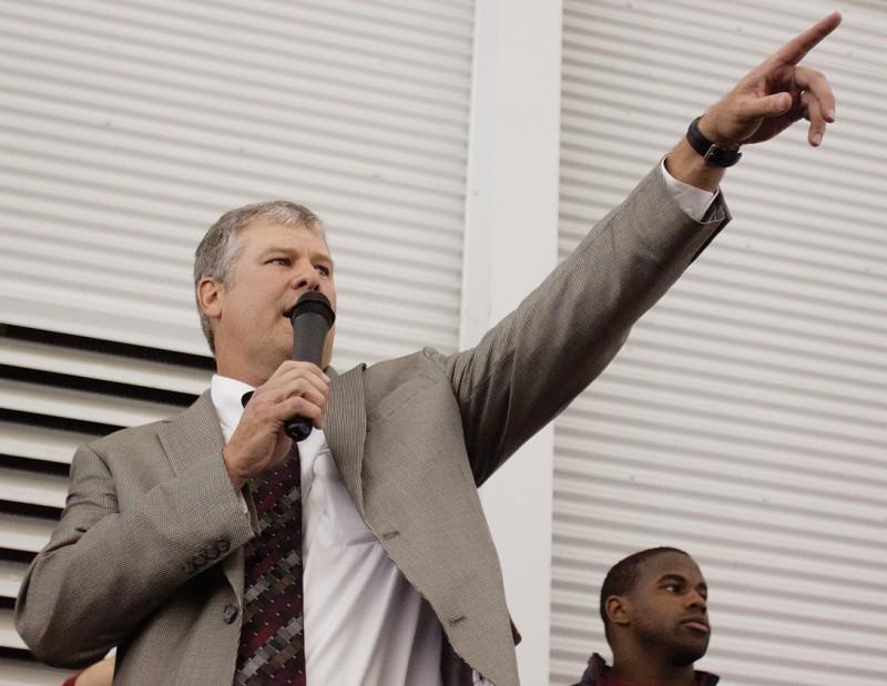 Football coach Paul Rhoads points to the band during the pep rally Saturday, Oct. 23 at Bergstrom Indoor Training Facility. The pep rally was open to all fans to interact with the team after its 28-21 victory over the Longhorns that afternoon in Austin, Texas.