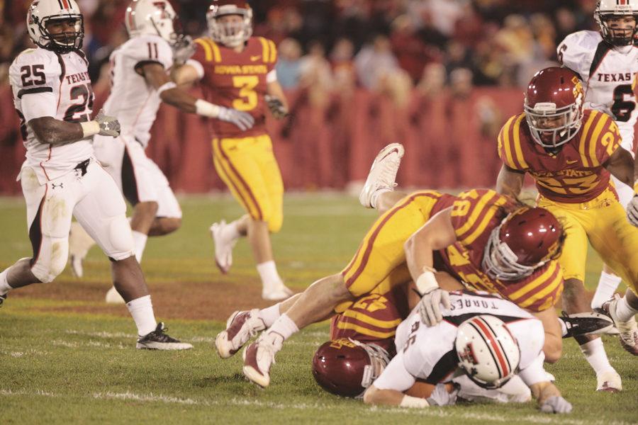 Jacob Lattimer finishes a tackle against Texas Tech on Oct. 3. Lattimer was named Big 12 Defensive Player of the Week.